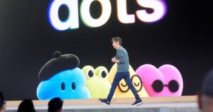 A photograph showing Sam Altman at the OpenAI DevDay conference discussing new AI initiatives.