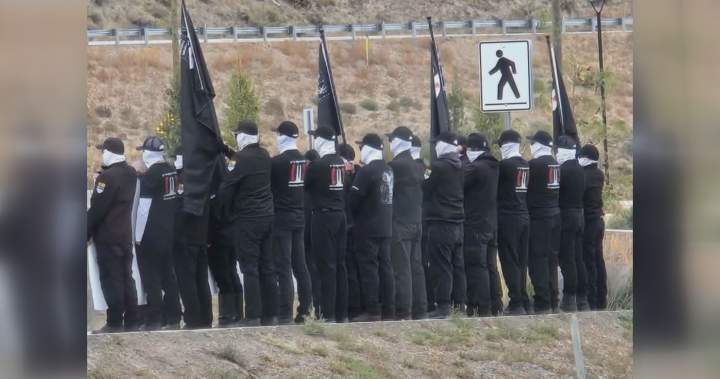 Masked individuals staging a protest on the Tk'emlúps te Secwépemc reserve.
