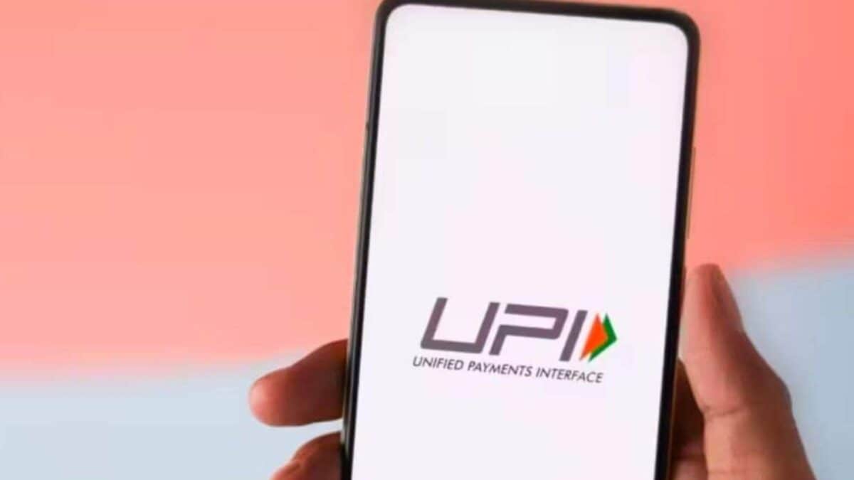 Illustrative image showing mobile phones with UPI payment interfaces and RuPay debit cards, symbolizing India's digital transaction growth.
