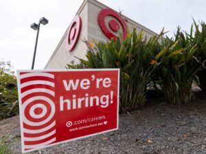 Sign outside a Target store indicating hiring, reflecting US job growth.