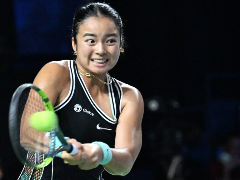 Alex Eala competing in a professional tennis match during the Asian Games.