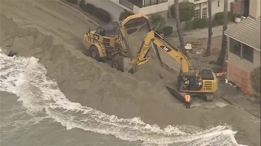 Value: Excavators working to protect homes on the California coast during Tropical Storm Rachel