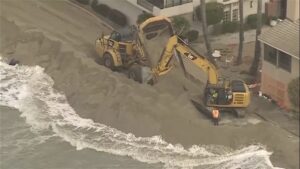 Value: Excavators working to protect homes on the California coast during Tropical Storm Rachel