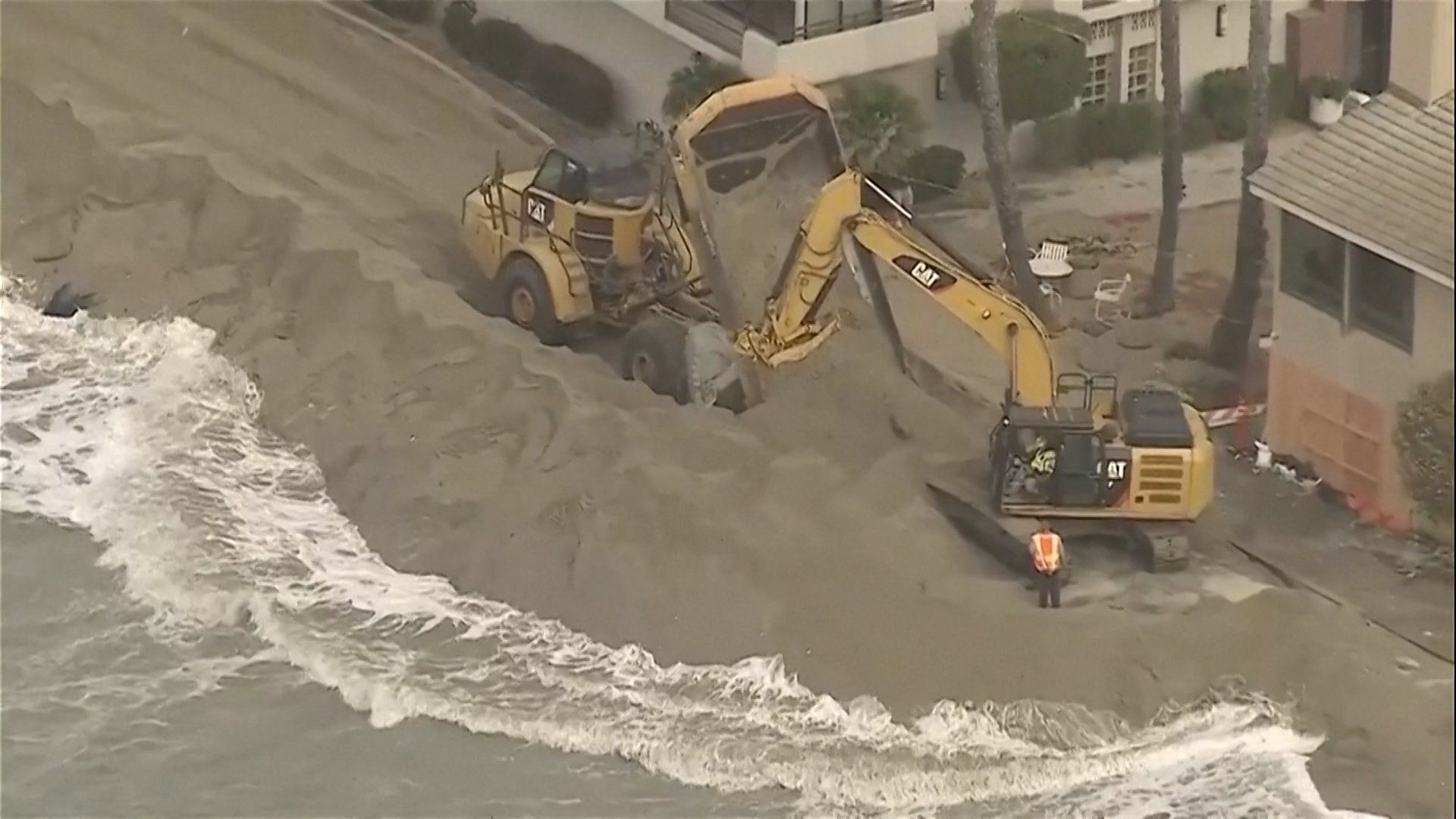 Value: Excavators working to protect homes on the California coast during Tropical Storm Rachel