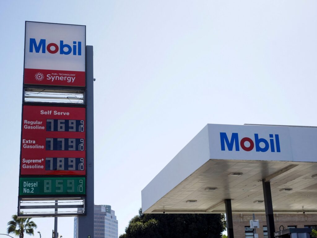 Gas station sign displaying high diesel and petrol prices during an energy supply crisis.