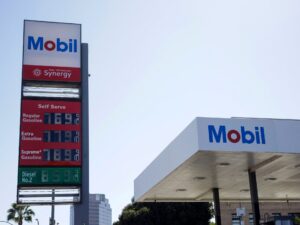 Gas station sign displaying high diesel and petrol prices during an energy supply crisis.