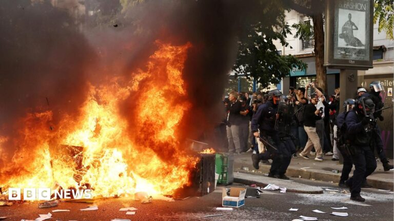 Riot police and protesters face off during the widespread student protests in France.