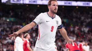 Harry Kane celebrates his record-equalling 125th appearance for the England national team during a UEFA Nations League match.