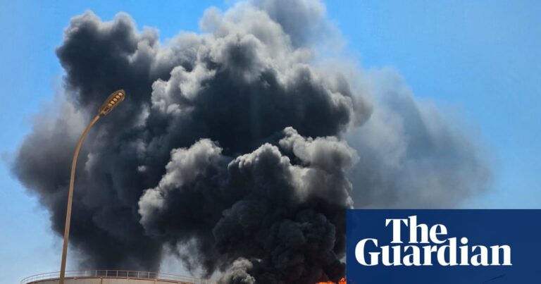 A plume of smoke rising from the Zawiya oil station following a drone strike, illustrating the instability in Libya.