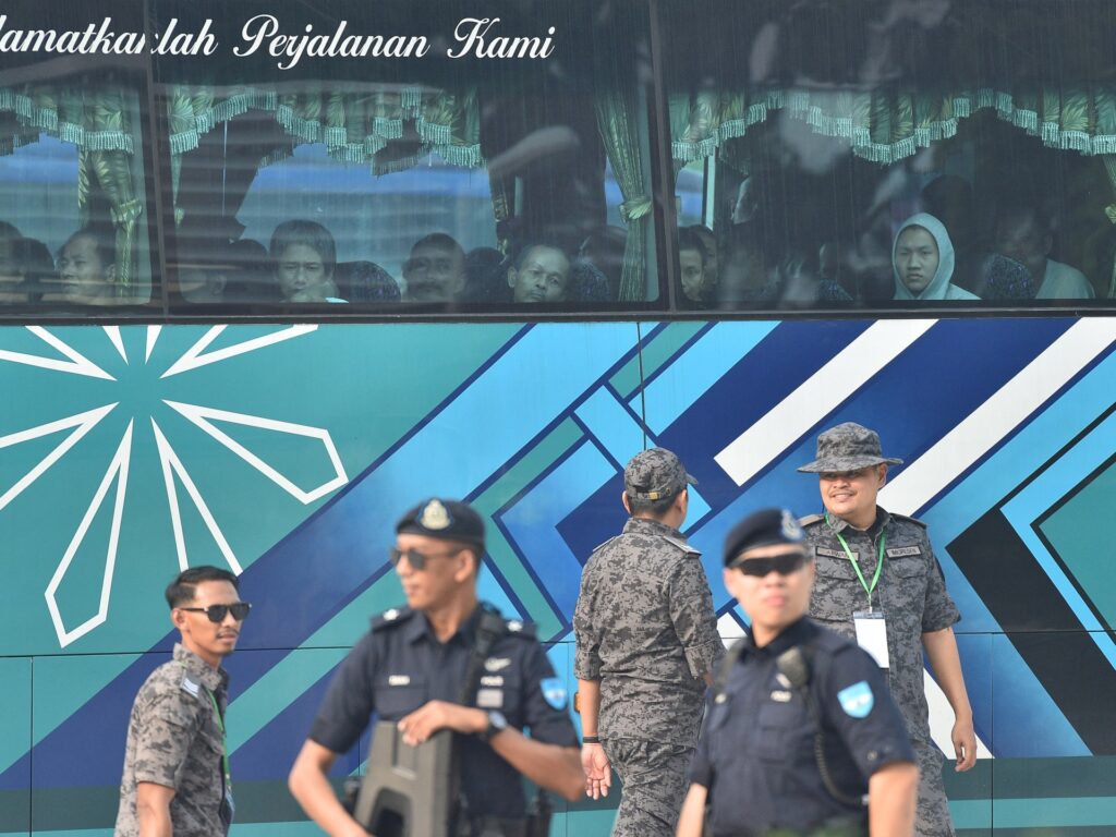 A military ship transporting Myanmar refugees back to a conflict zone despite human rights warnings.