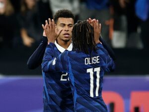 France players celebrating after their dominant 4-1 Nations League victory over Belgium at the Stade de France.