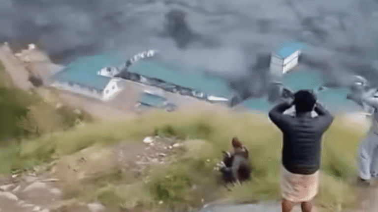 Value: Aerial view of destroyed residential buildings and infrastructure following the devastating Nepal flash flood in Gorkha district.