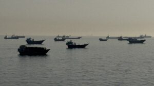 Indian sailors injured following a projectile attack on a commercial vessel in the Strait of Hormuz.