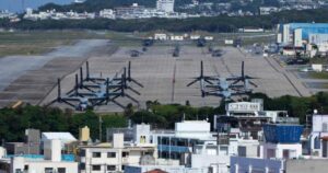 A photograph showing U.S. MV-22 Osprey transport aircraft parked at the U.S. Marine Corps Air Station Futenma in Okinawa, Japan.