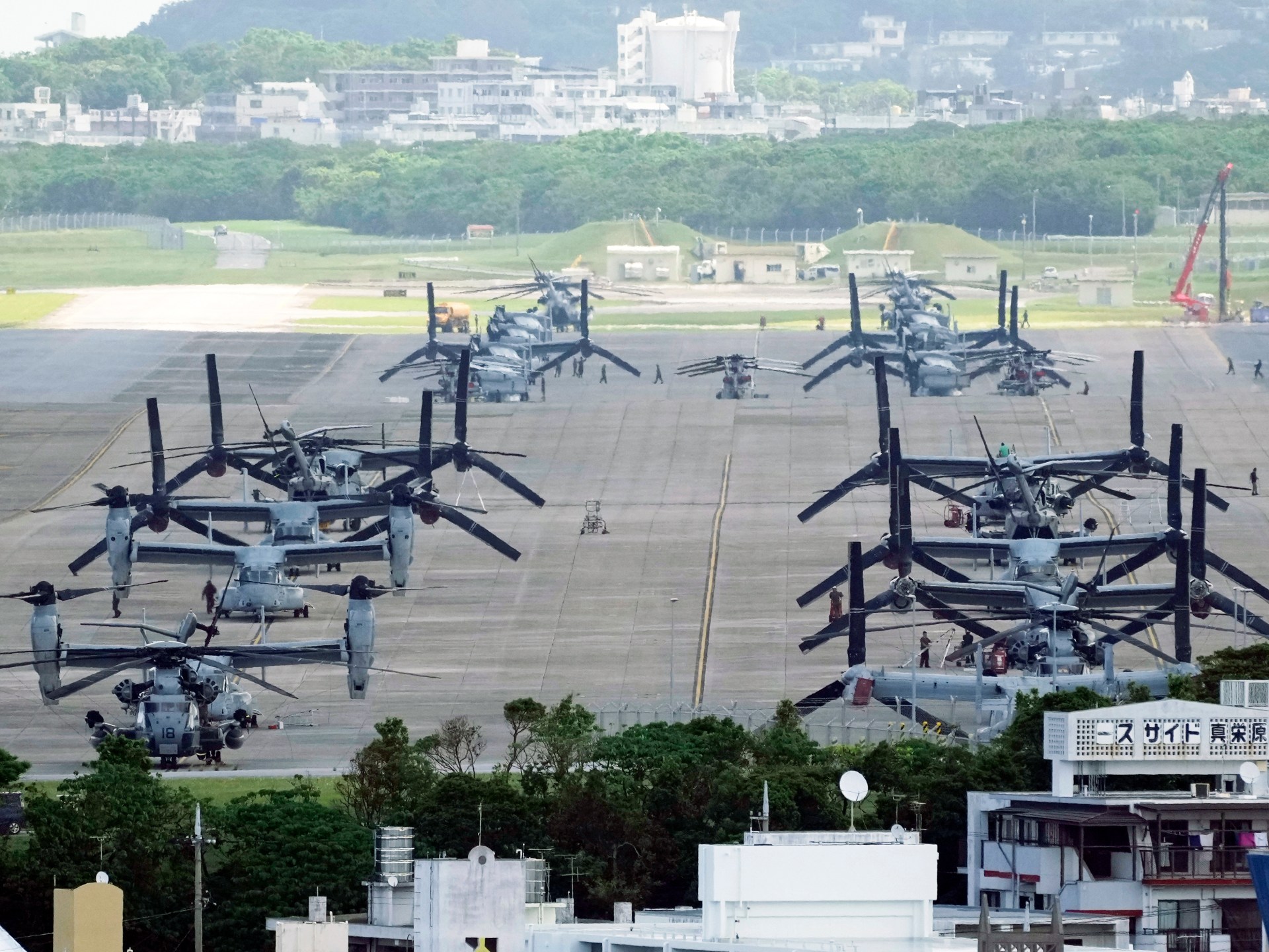 Protesters gather in Japan after a US Marine is arrested in connection with a killing in Okinawa.